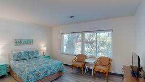 En eller flere senge i et værelse på Atlantic Breeze #6