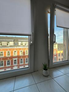 a room with a window with a view of a building at 64qm für 3 Personen in Niederdorla