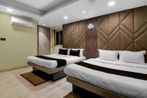 Ένα ή περισσότερα κρεβάτια σε δωμάτιο στο Hotel O KOLKATA SEVEN INN LLP