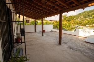 a large patio with a view of a mountain at Casa Rubí comfortable and with a private pool in Zihuatanejo