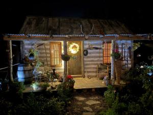 a model of a house with plants and flowers at The Karal cabin in Canterbury