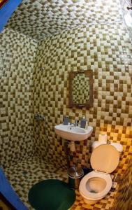 a bathroom with a toilet and a sink at Riad misk lile fez in Fès +39 photos