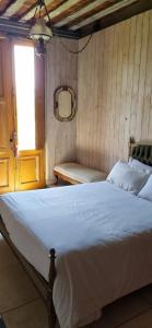 a bedroom with a large white bed and a window at El Granero Apart hotel in Mar del Plata