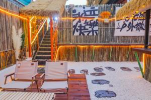 a group of chairs sitting on a beach with a staircase at Sky Garden Osmanthus Hostel - Drum & Bell City Center in Xi'an