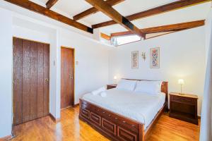 Ένα ή περισσότερα κρεβάτια σε δωμάτιο στο Cabaña Miramar 3D Wifi y Piscina