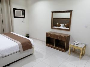 Postel nebo postele na pokoji v ubytování فندق نجمه الشمس