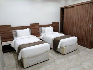 Postel nebo postele na pokoji v ubytování فندق نجمه الشمس