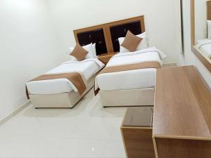 Postel nebo postele na pokoji v ubytování فندق نجمه الشمس + 4 fotografie