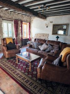 Posezení v ubytování Le cottage de Maddie - charme, calme et authenticité