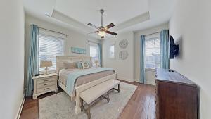 a bedroom with a bed and a ceiling fan at Prominence 30A - Mint Julep in Inlet Beach +33 photos