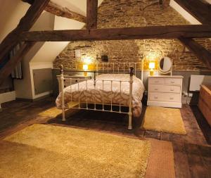 Postel nebo postele na pokoji v ubytování Le cottage de Maddie - charme, calme et authenticité