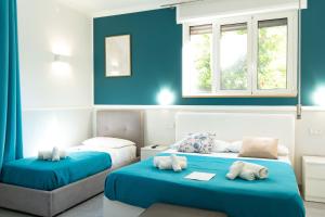 Ένα ή περισσότερα κρεβάτια σε δωμάτιο στο Royal Rooms Portici