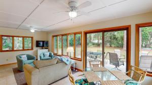 a living room with a couch and a table at Reflection in Jekyll Island