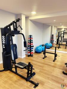 a gym with several tread machines in a room at Compact Time 1402 in Tambaú