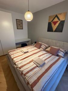 Postel nebo postele na pokoji v ubytování Kamence apartment