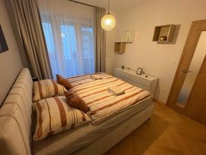 Postel nebo postele na pokoji v ubytování Kamence apartment