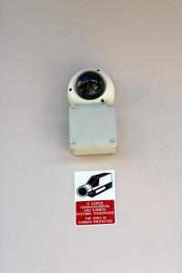 a light on a wall with a sign on it at Aenaon Corfu Luxury Apartments #04 - Aphrodite Apartment in Ýpsos