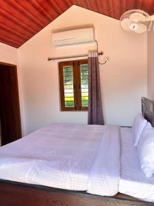 Ένα ή περισσότερα κρεβάτια σε δωμάτιο στο The Kumaoni Homestay