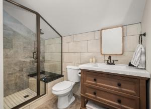 a bathroom with a shower and a toilet and a sink at New! The South Hill Sanctuary-4 min to Manito Park in Spokane +82 photos
