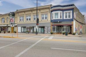 an intersection of an empty street with a building at 1 Mi to Lake Michigan! Urban Racine Apartment in Racine