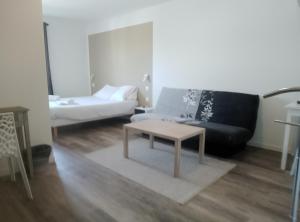 Ένα ή περισσότερα κρεβάτια σε δωμάτιο στο Némo