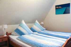 Ein Bett oder Betten in einem Zimmer der Unterkunft Pension Nordsee