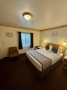 Postel nebo postele na pokoji v ubytování Ocean Breeze Motel