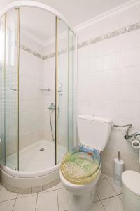 a bathroom with a glass shower and a toilet at Creta Sea View 2BR Maisonette by ΜΡS in Marathokefála +29 photos