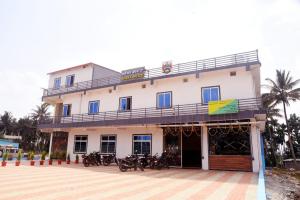 a building with motorcycles parked in front of it at SOWMYA RESIDENCy in Piriyāpatna