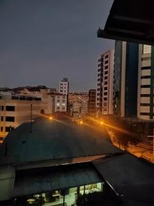 a view of a city at night with street lights at Casa Rumi - Guesthouse in La Paz