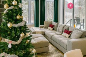 a living room with a christmas tree and a couch at The Green Chill at Cité-Jardin - Private SPA, Ping pong, Fireplace & Pool in Saint-Basile