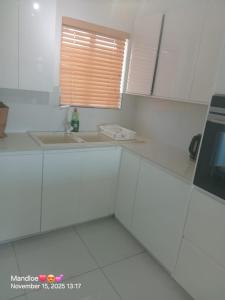 Kuchyň nebo kuchyňský kout v ubytování Classy Budget Apartment