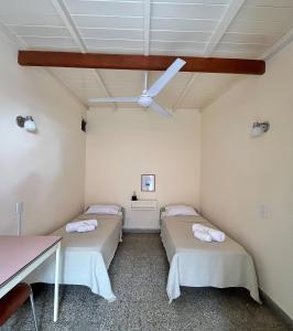 Ένα ή περισσότερα κρεβάτια σε δωμάτιο στο Lo de Sarita Hostería