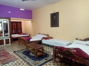 Ένα ή περισσότερα κρεβάτια σε δωμάτιο στο Valley Dew Village Stay