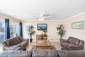 a living room with two couches and a ceiling fan at Pet-Friendly 3Br W Ac & Rooftop Deck 2 Houses From Beach By Beachview Rentals in Newport Beach