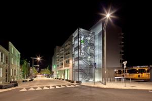 a building on a city street at night at Campanile La Roche Sur Yon Centre Gare in La Roche-sur-Yon