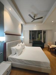 Ένα ή περισσότερα κρεβάτια σε δωμάτιο στο Hotel Pacific Primee