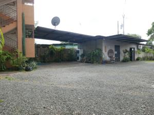 a patio of a house with a garage at Apart-hotel alessia in Santiago