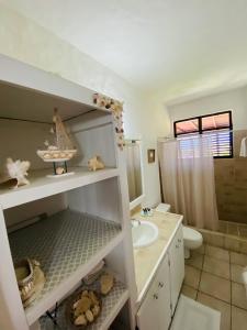 a bathroom with a sink and a toilet and a shower at Paradise View in Gros Islet
