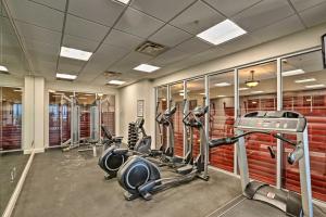 a gym with several treadmills and cardio machines at Community Perks! Dreamy Daytona Studio in Daytona Beach