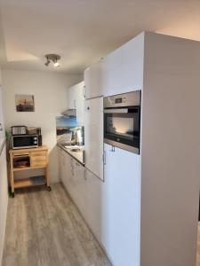 Η κουζίνα ή μικρή κουζίνα στο Appartement 103 Seeseite +9 φωτογραφίες
