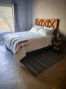 Ένα ή περισσότερα κρεβάτια σε δωμάτιο στο Neotha Villa