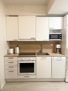 Kuchyň nebo kuchyňský kout v ubytování Apartment Tiira