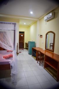 A bed or beds in a room at Hotel Finlanka