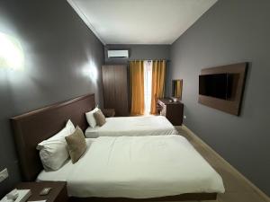 Postel nebo postele na pokoji v ubytování The Windsor Hotel + 34 fotografií