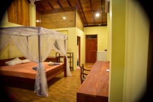 A bed or beds in a room at Hotel Finlanka
