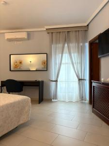 TV a/nebo společenská místnost v ubytování Hostal Cerezo 2