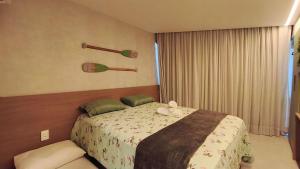 Postel nebo postele na pokoji v ubytování Atlântico Carneiros - Pé na areia no melhor trecho da Praia dos Carneiros