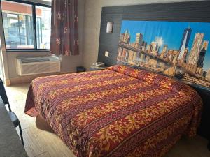 Postel nebo postele na pokoji v ubytování Apple Motel