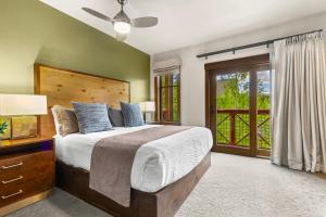 a bedroom with a bed and a sliding glass door at Hyatt Main Street Station Studio in Breckenridge +17 photos